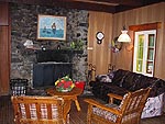The living room with a beautiful stone fireplace